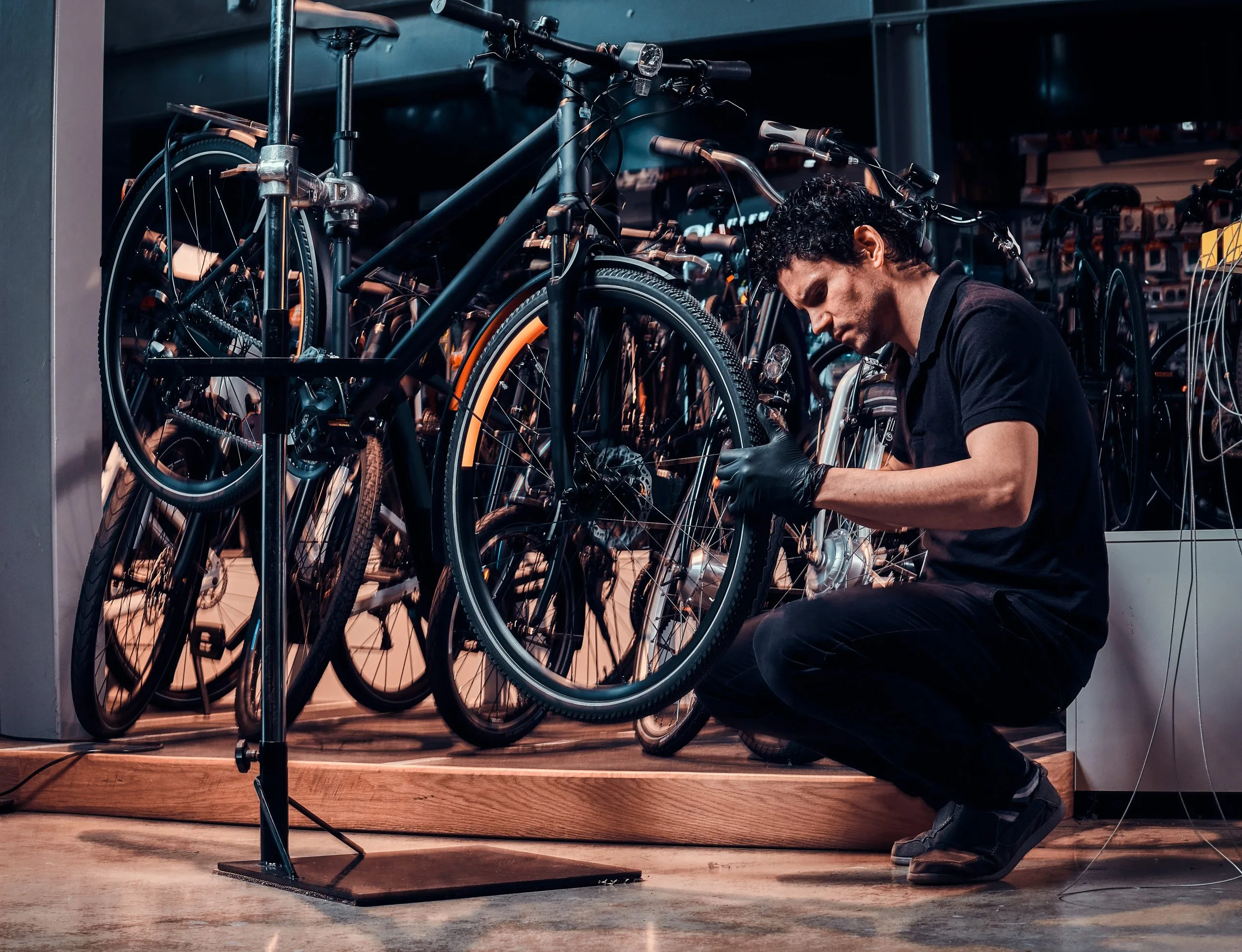 Vietnam Bicycle Market Growth Supported by USD 209 Million Bike-Sharing Demand and Sustainable Mobility Trends expirienced-young-master-is-repairing-customer-s-bicycle-workplace-scaled