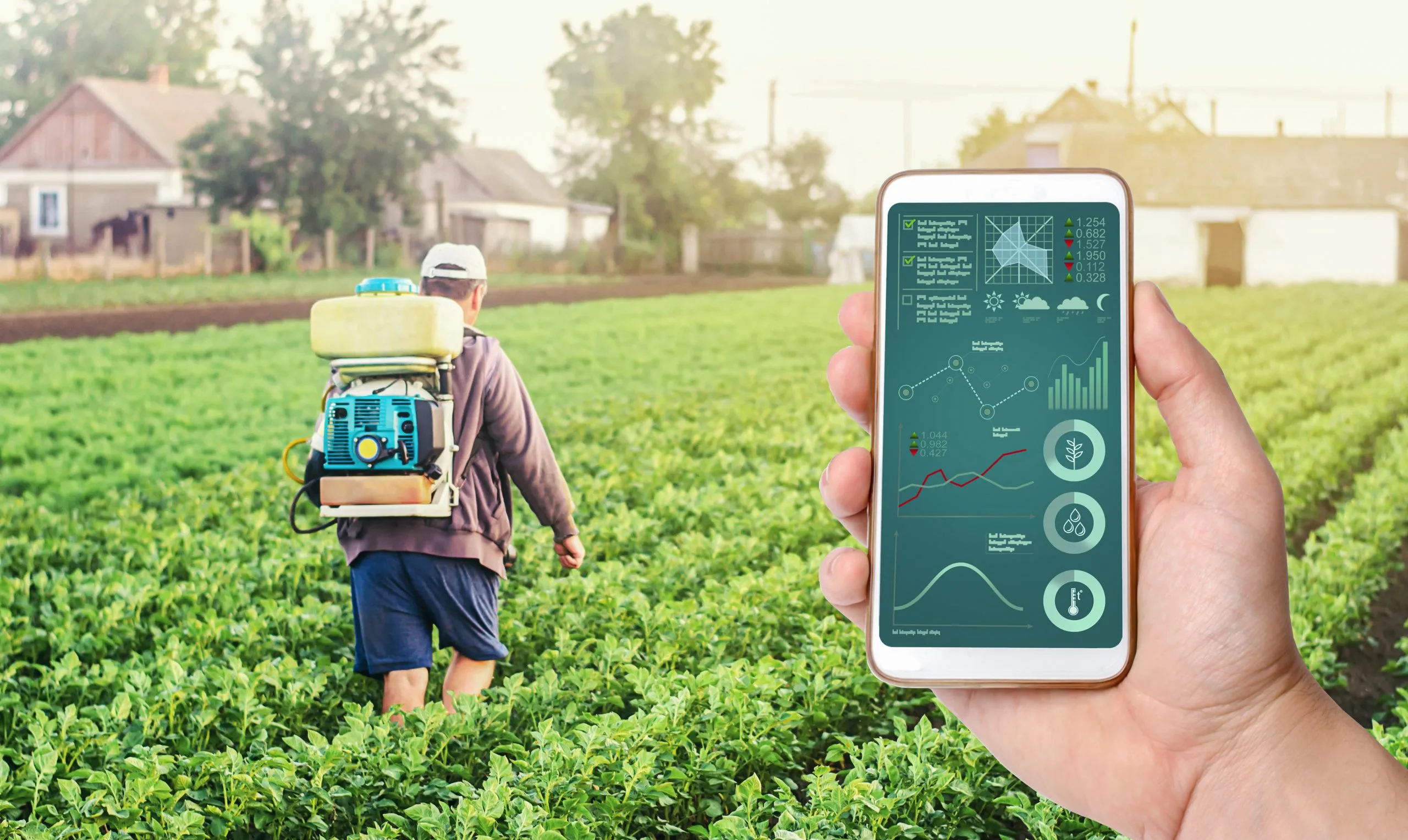 Philippines Smart Agriculture Market Builds Momentum as Global Smart Farming Heads Toward USD 113 Billion hand-with-phone-background-farmer-with-agriculture-smoke-fog-spraying-machine-scaled