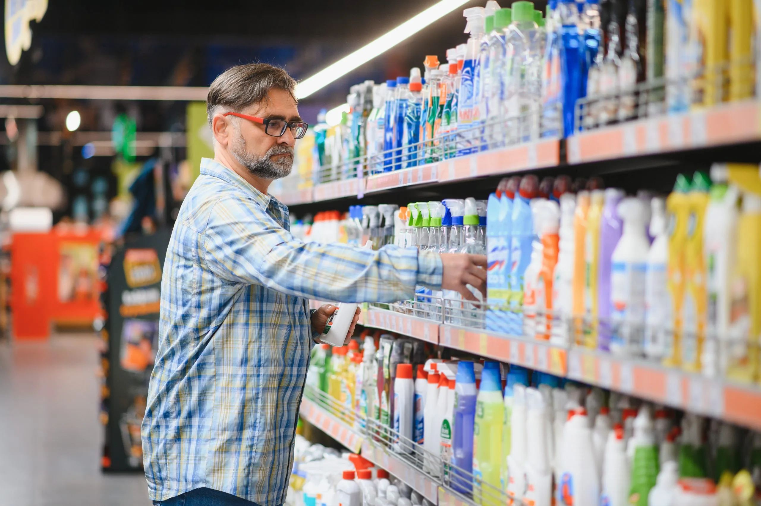 Saudi Arabia Household Cleaners Market Outlook Backed by USD 508.8 Million Opportunity and Product Innovation portrait-focused-man-buying-household-chemicals-supermarket-reading-labels-bottles-scaled