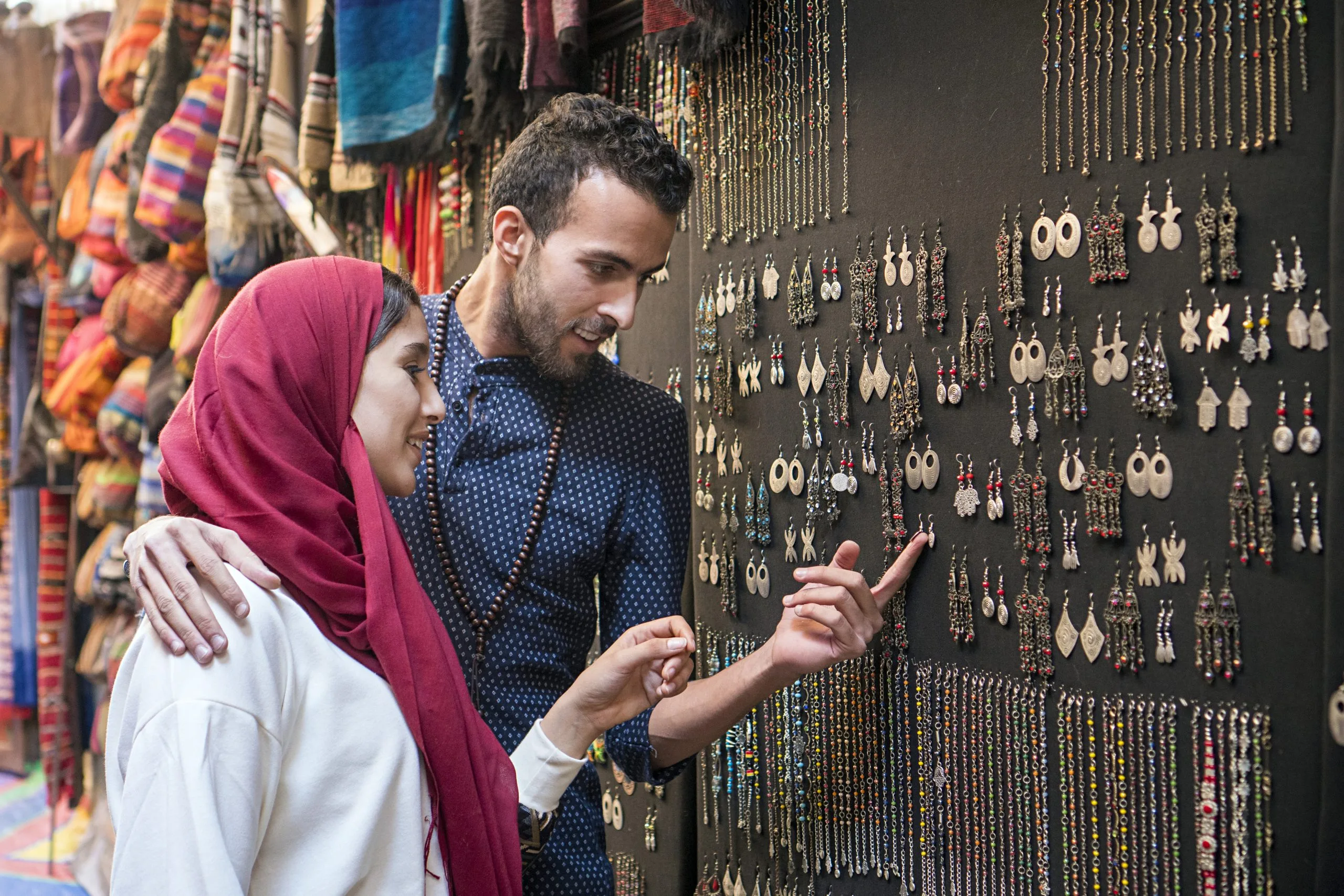 KSA Fashion Accessories Market Growth Backed by USD 30 Billion Revenue Potential smiling-young-muslim-couple-shopping-jewelry-scaled