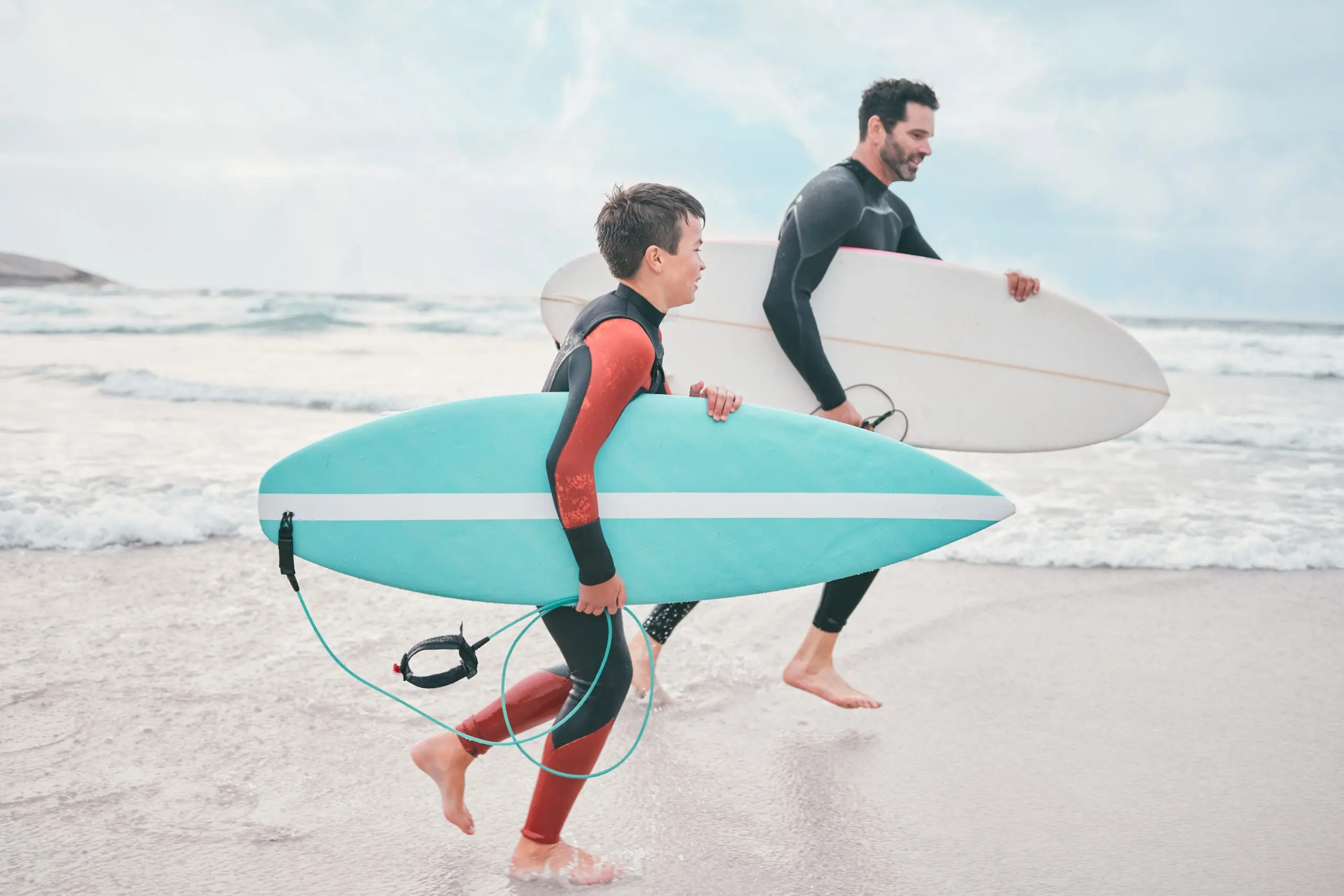 Brazil Surfing Equipment Market Expands as Surfing Gains Traction Across Brazil with 7,400 Kilometer Coastline surfboard-dad-child-beach-running-sports-exercise-outdoor-bonding-adventure-surfer-father-son-ocean-surfing-teaching-learning-together-love-support-growth-scaled