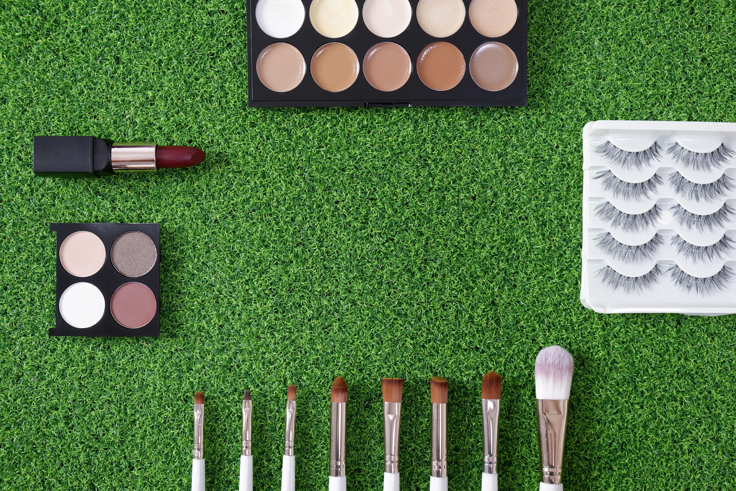 UK Artificial Turf Market to Reach USD 702.8 Million as Synthetic Grass Adoption Expands top-view-women-s-cosmetic-green-background-scaled