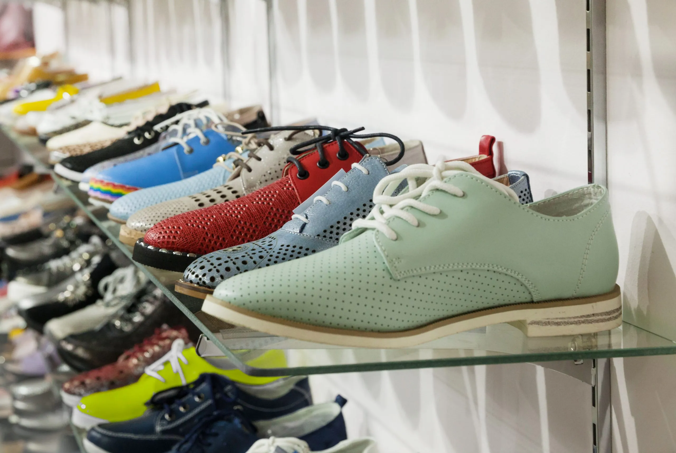 Brazil Sports Shoes Market Benefits from South America Athletic Footwear Growth Toward USD 20.81 Billion women-s-summer-shoes-made-colored-leather-store-shelf-scaled