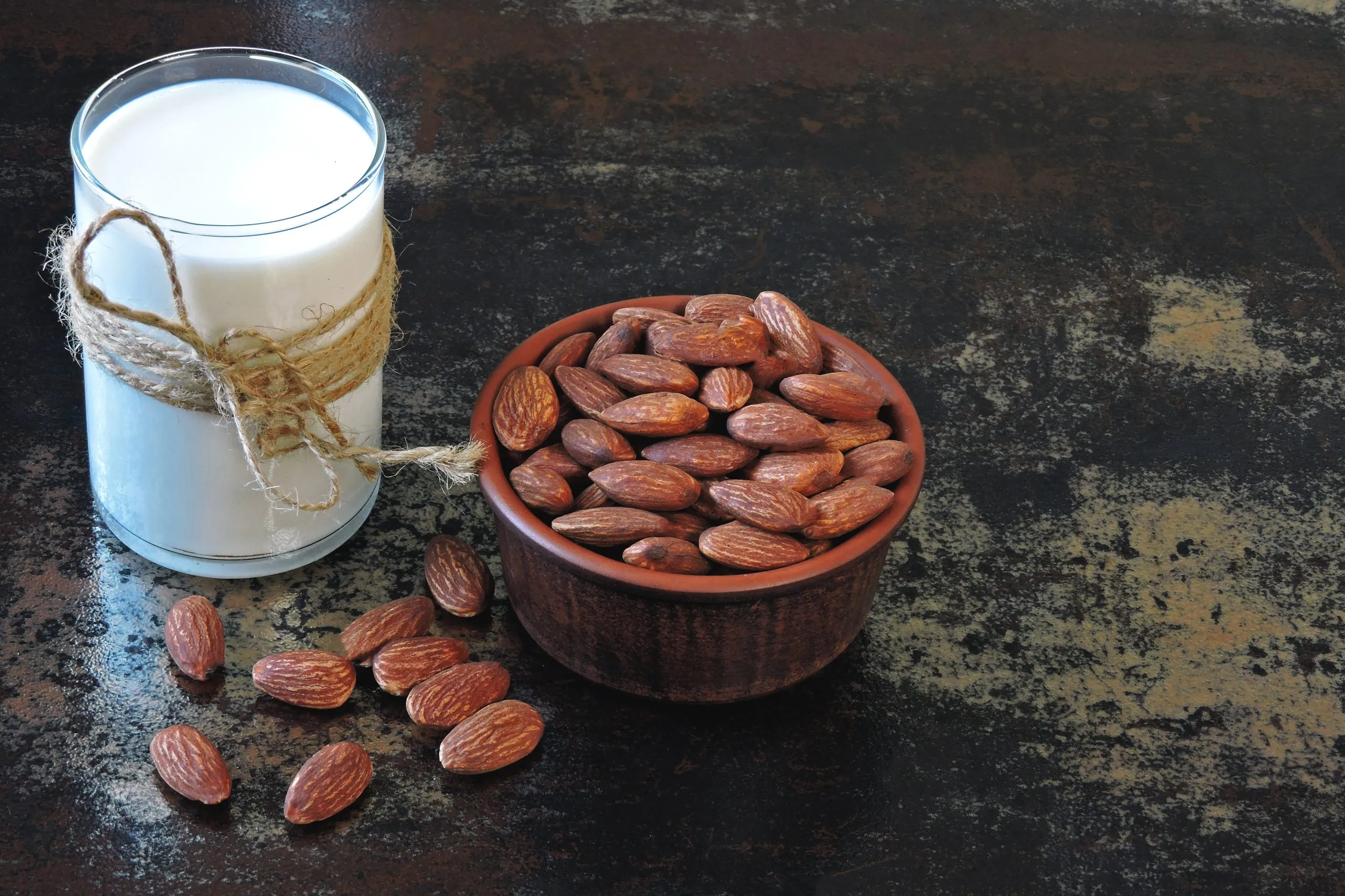 UAE Almond Milk Market Expected to Reach USD 1.59 Billion Driven by Rising Demand for Dairy-Free Nutrition almond-milk-raw-almonds-bowl-stylish-shabby-background-scaled