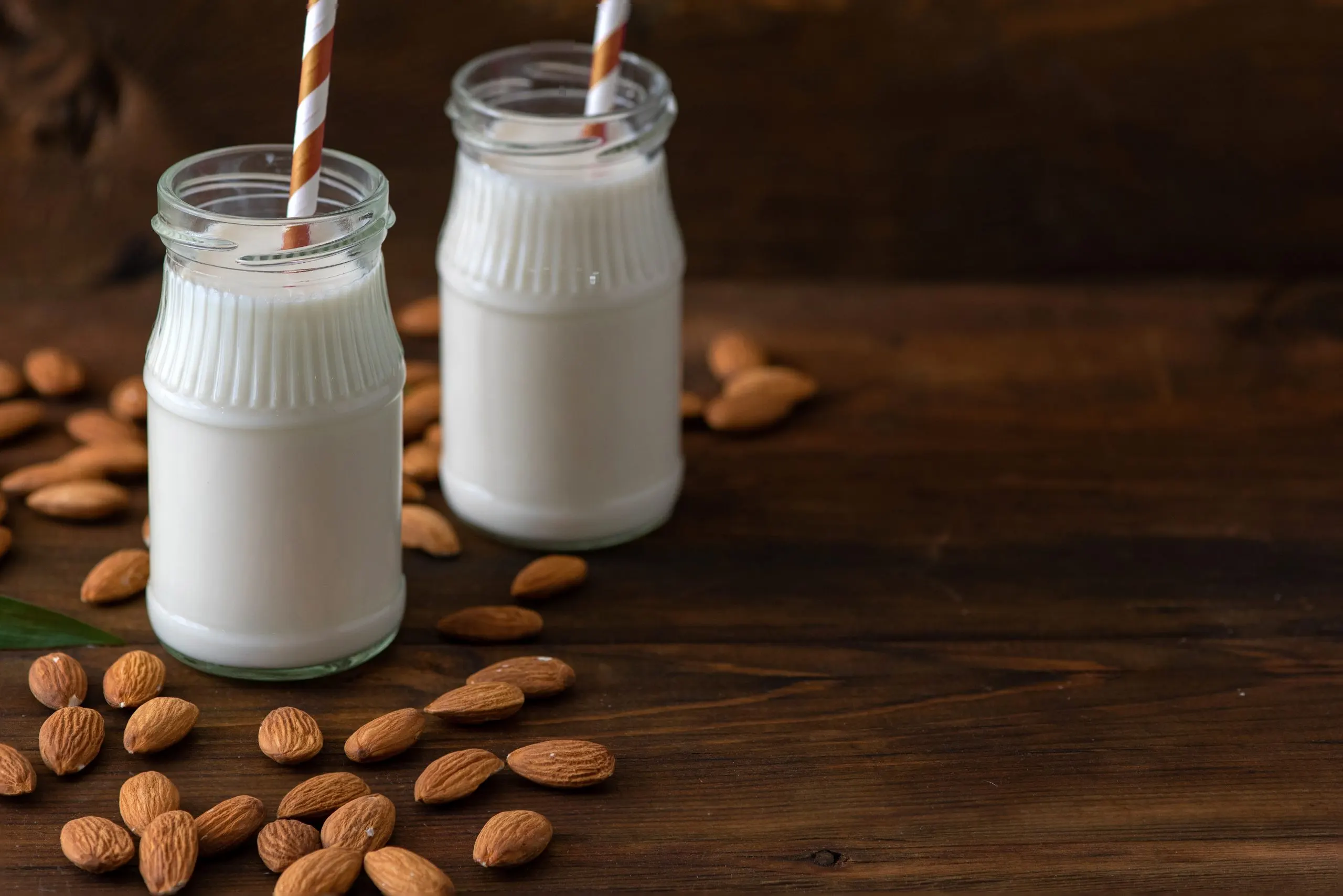 Vietnam Almond Milk Market Expected to Reach USD 174 Million Driven by Rising Health Consciousness almond-milk-with-almond-dark-wooden-table-scaled