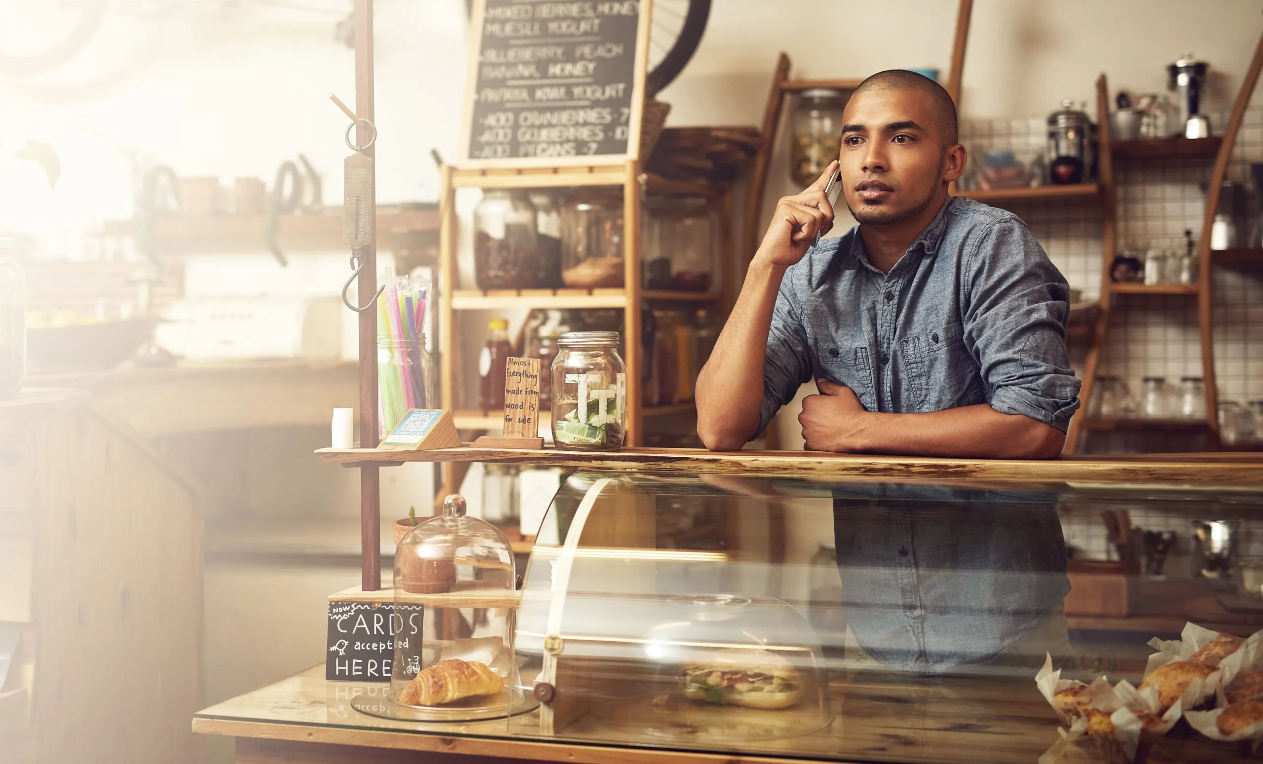 Nigeria Cafes and Bars Market Driven by 139 Million Internet Subscribers and Growing Digital Ordering Trends phone-call-listening-man-cafe-conversation-communication-with-supplier-order-stock-talking-entrepreneur-person-with-mobile-chat-planning-delivery-small-business-scaled