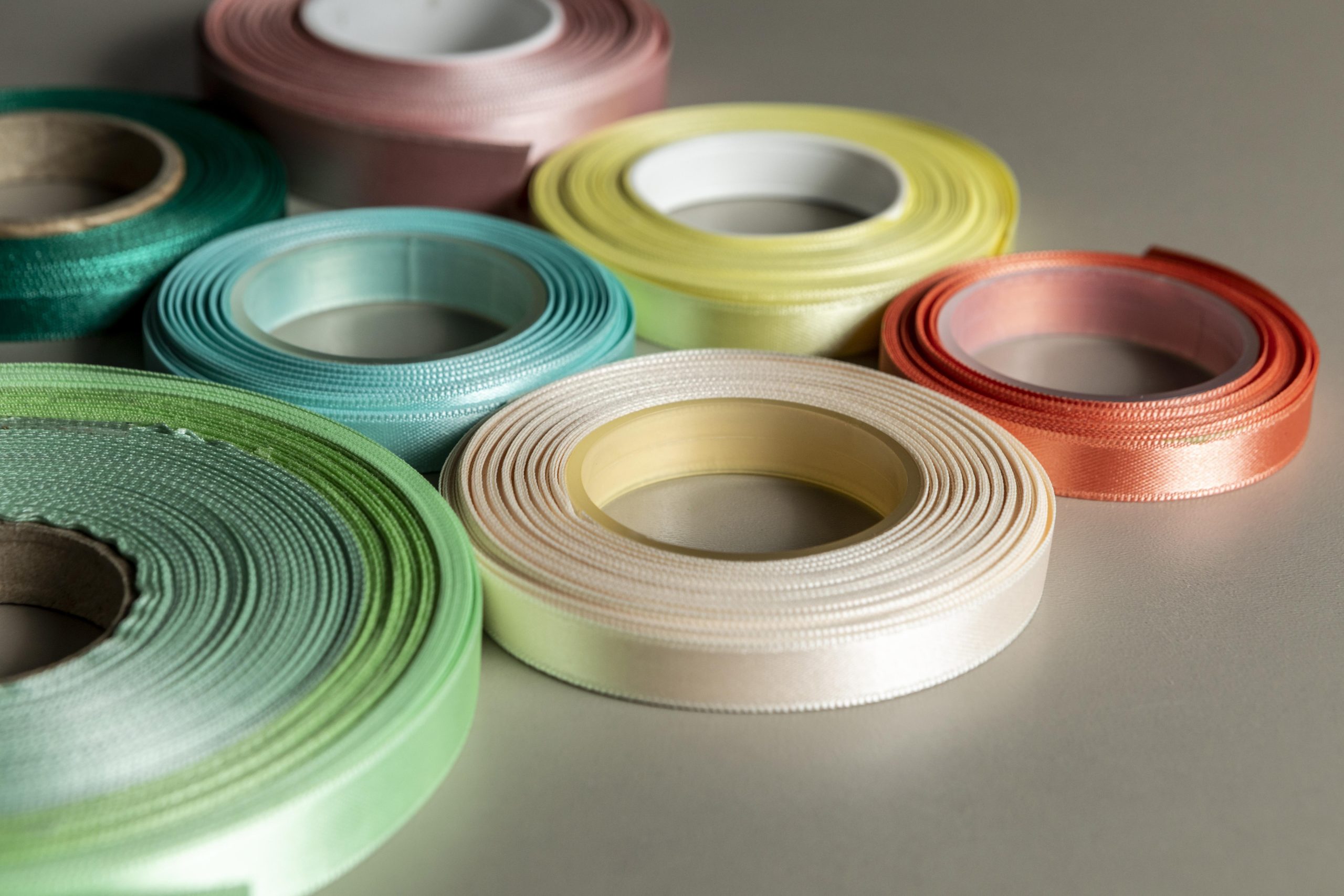 UAE Adhesive Tapes Market Outlook to 2035 high-angle-colorful-glossy-ribbons-scaled