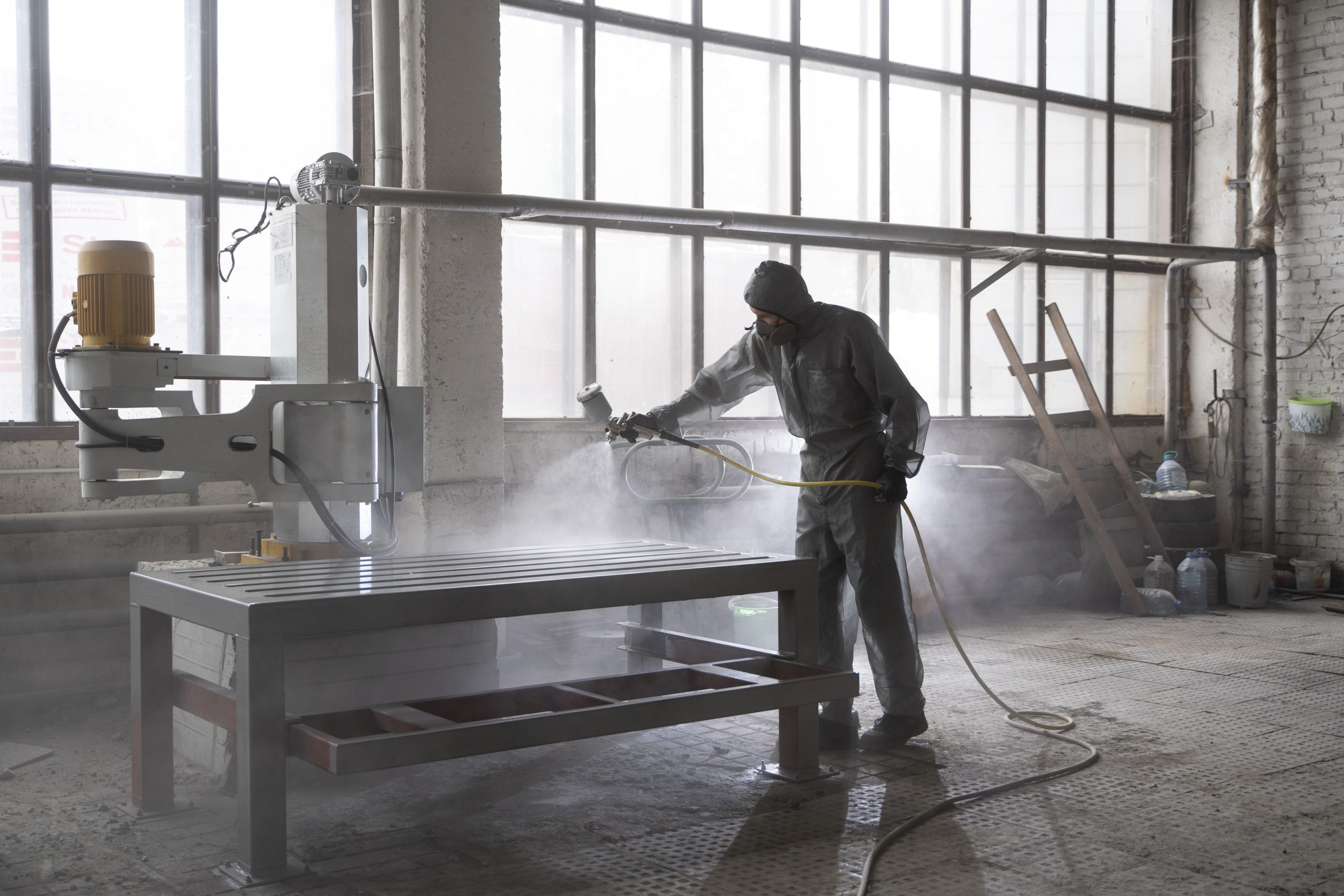 Thailand Powder Coating Market Outlook to 2035 man-spraying-powder-paint-from-gun-full-shot-scaled