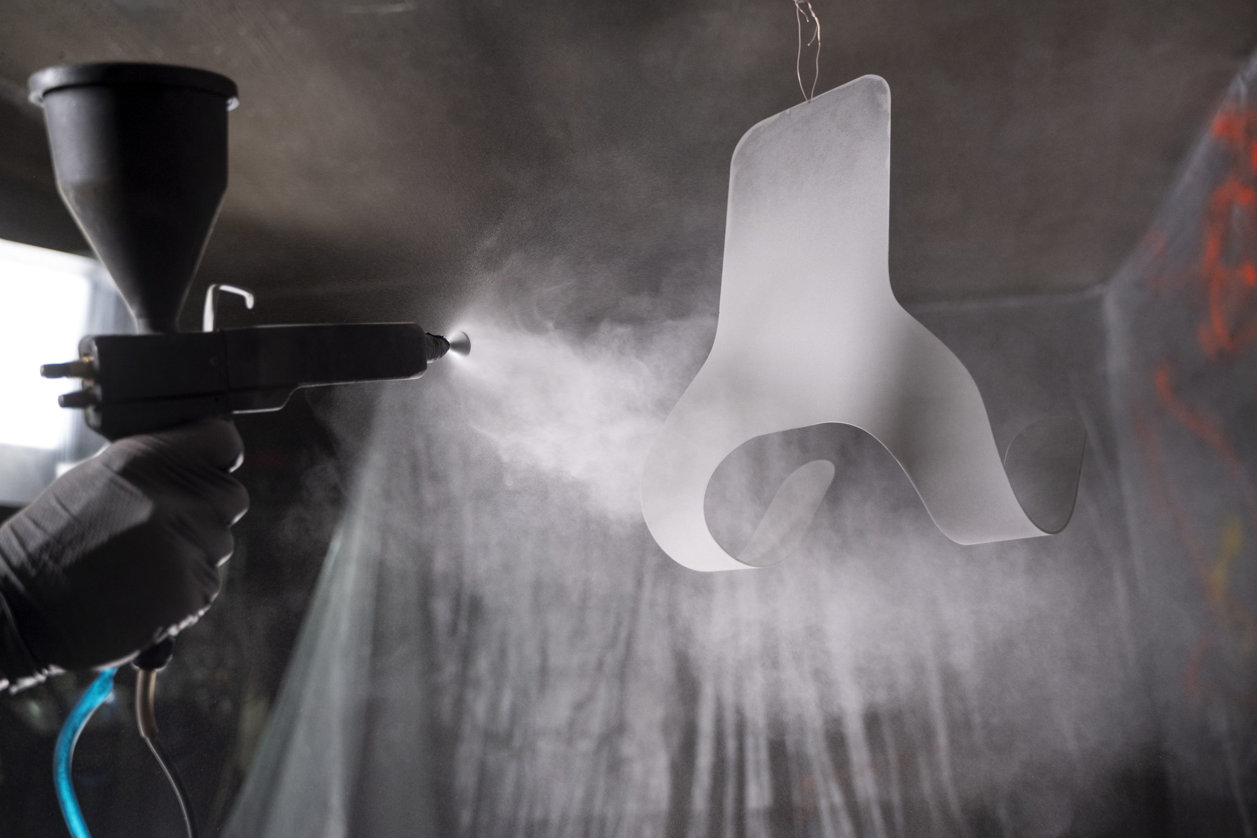 Germany Powder Coating Market Outlook to 2035 man-working-with-paint-gun-side-view-scaled