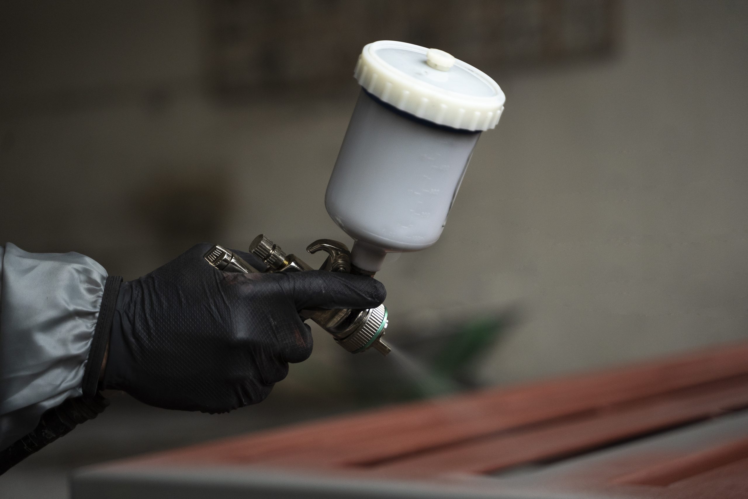 Italy Powder Coating Market Outlook to 2035 side-view-hand-spraying-powder-paint-from-gun-scaled