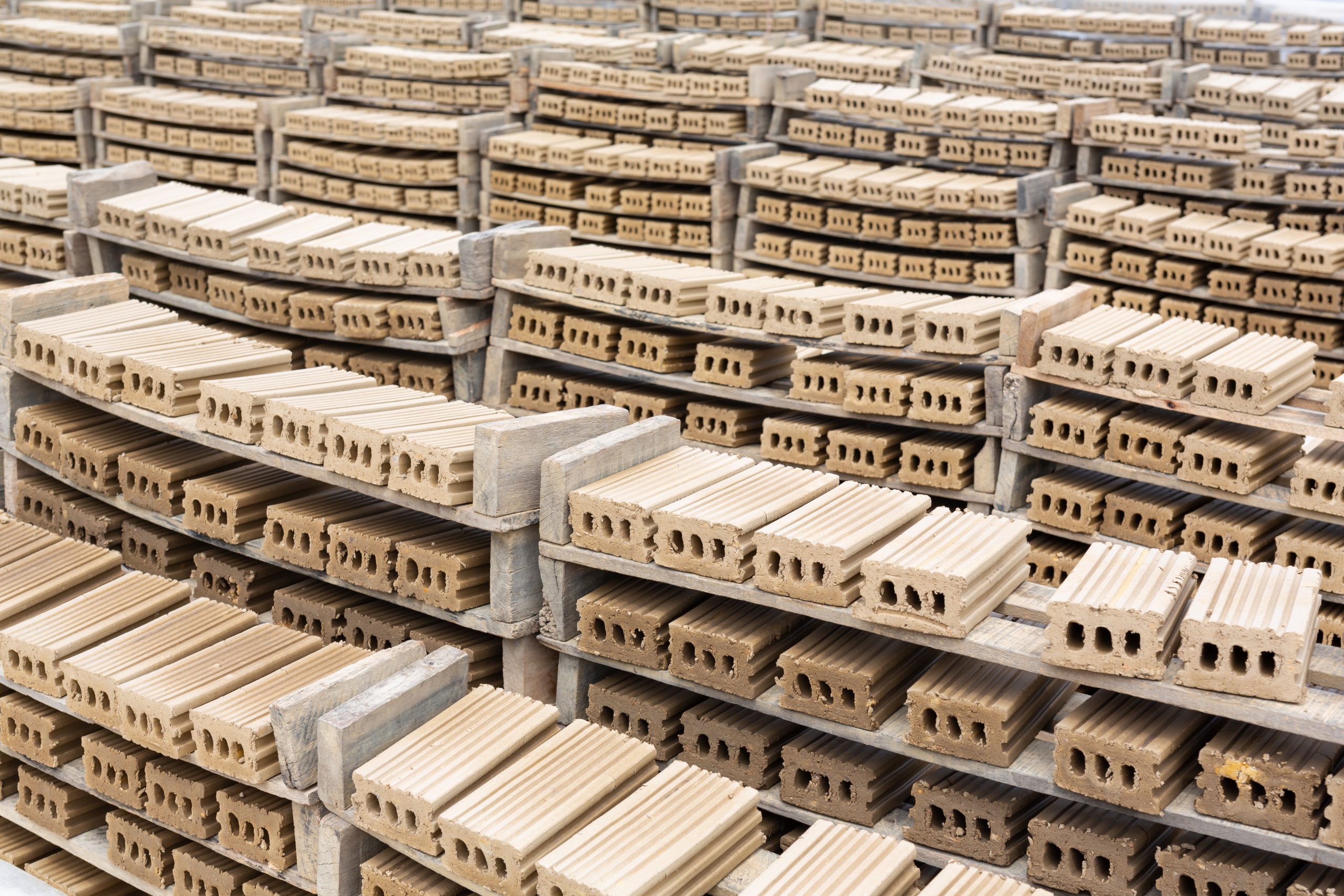 US Insulated Concrete Form Market Advances as USD 0.50 Billion Industry Supports Efficient Construction brick-piles-placed-factory-floor-scaled