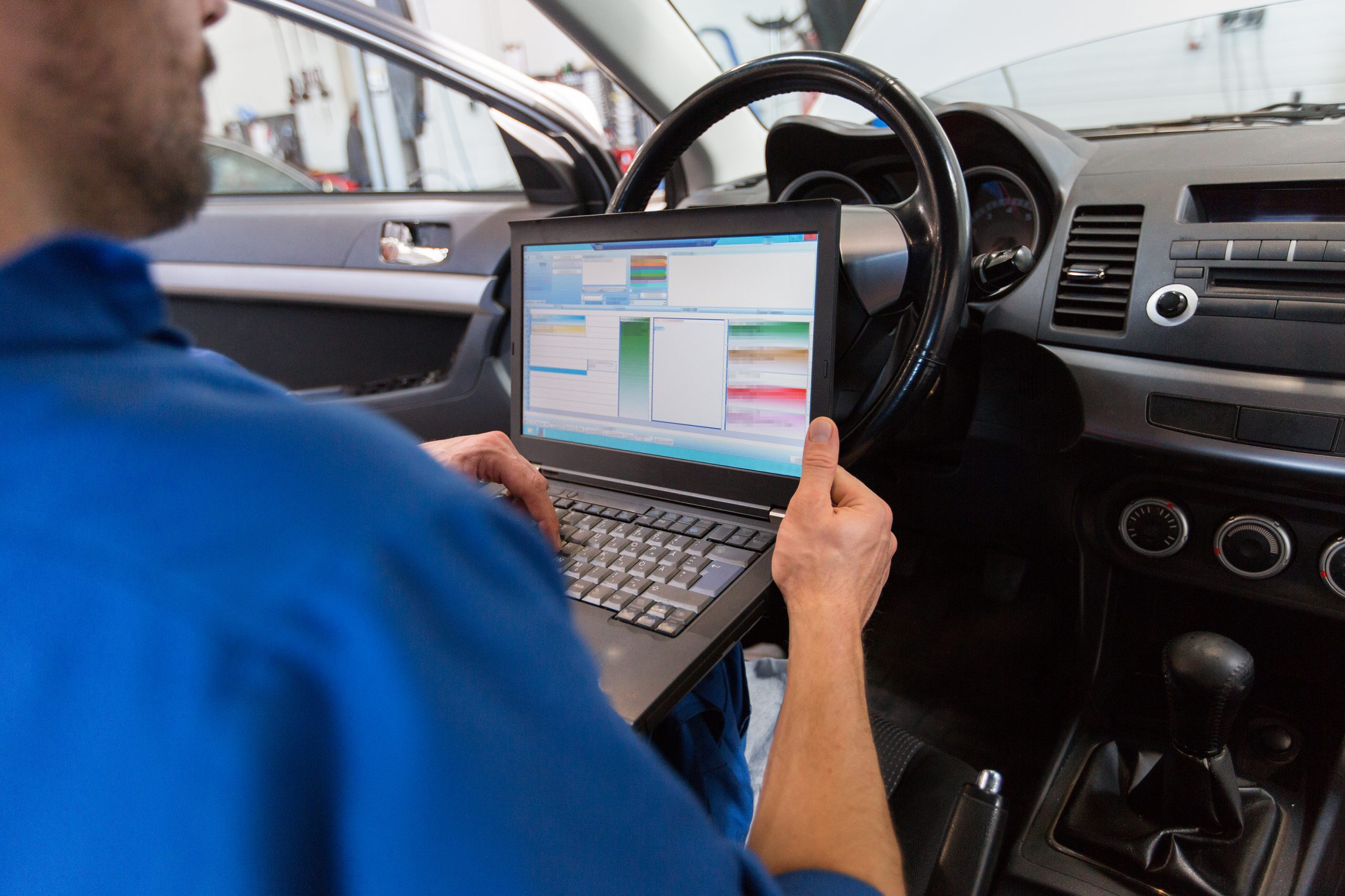 Vietnam In-Vehicle Computer System Market Outlook to 2035 car-service-repair-maintenance-people-concept-mechanic-man-with-laptop-computer-making-system-diagnostic-workshop-1-scaled