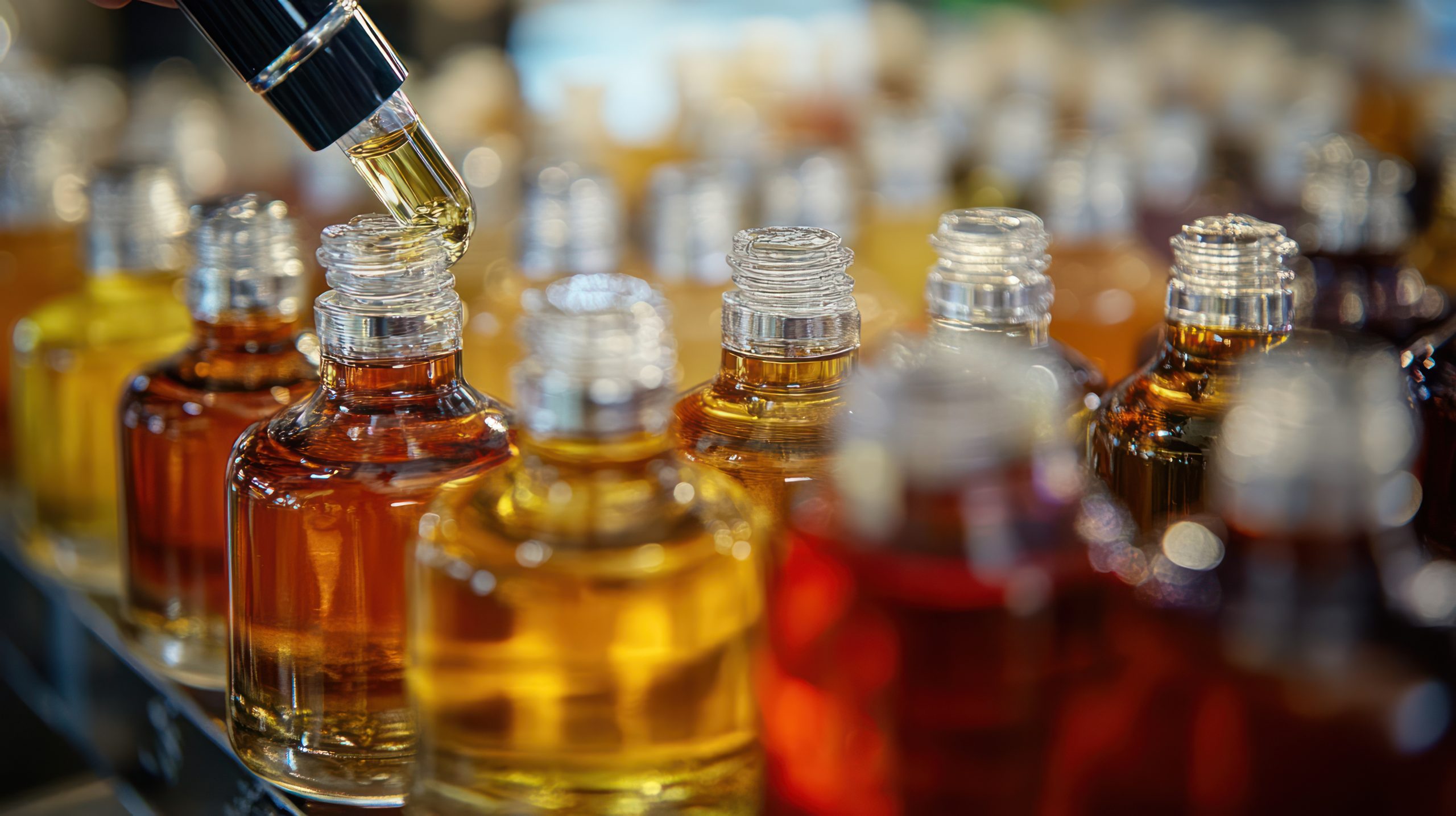 Thailand Polyglycolic Acid Market Advances as USD 2.23 Billion Medical Device Sector Expands closeup-shot-dropper-bottle-with-liquid-being-dispensed-into-another-bottle-bottles-are-lined-up-row-with-focus-bottle-foreground-1-scaled