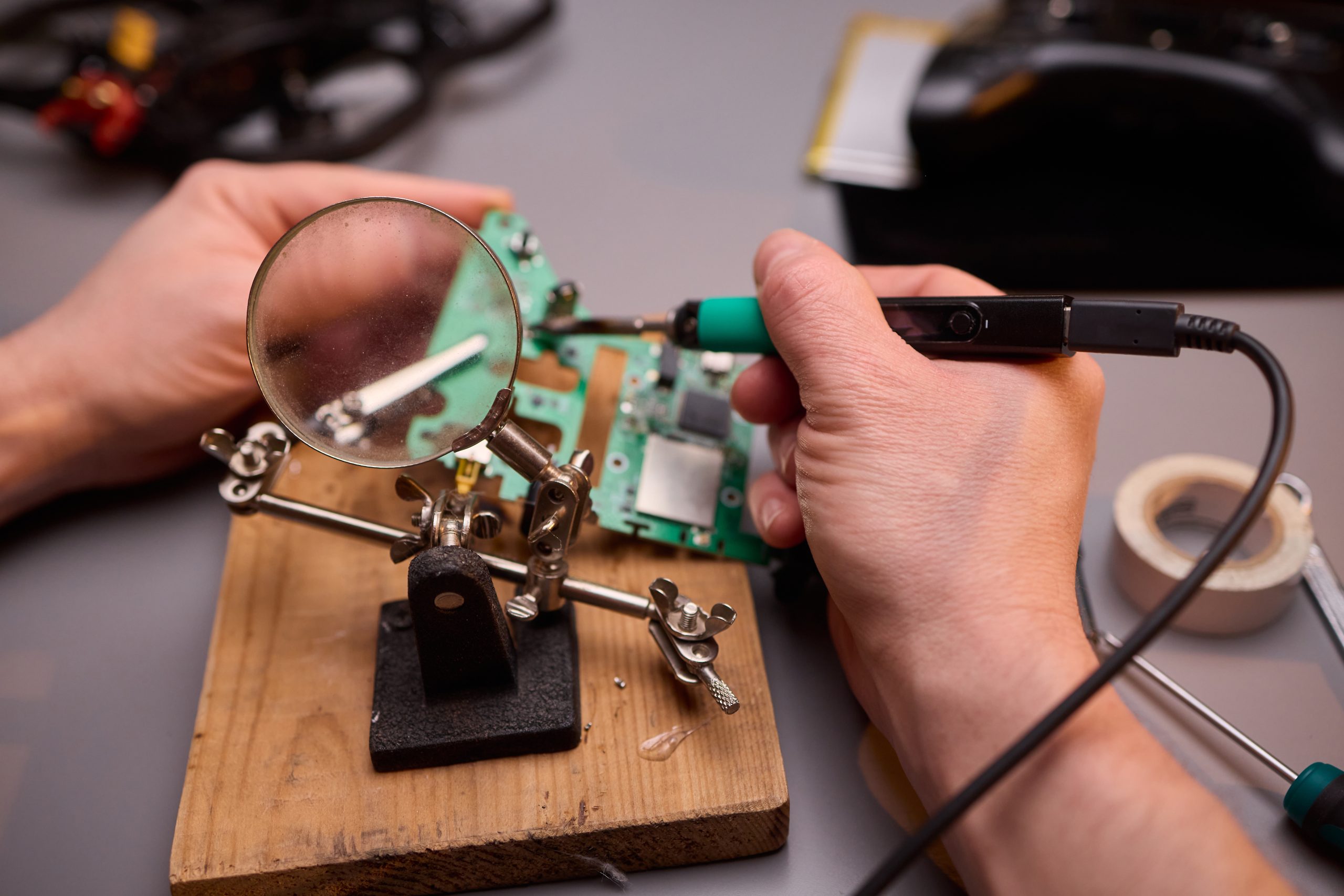 Malaysia Flexible Electronics and Circuit Market Outlook to 2035 hands-carefully-repairing-circuit-board-with-soldering-tool-electronics-projects-scaled