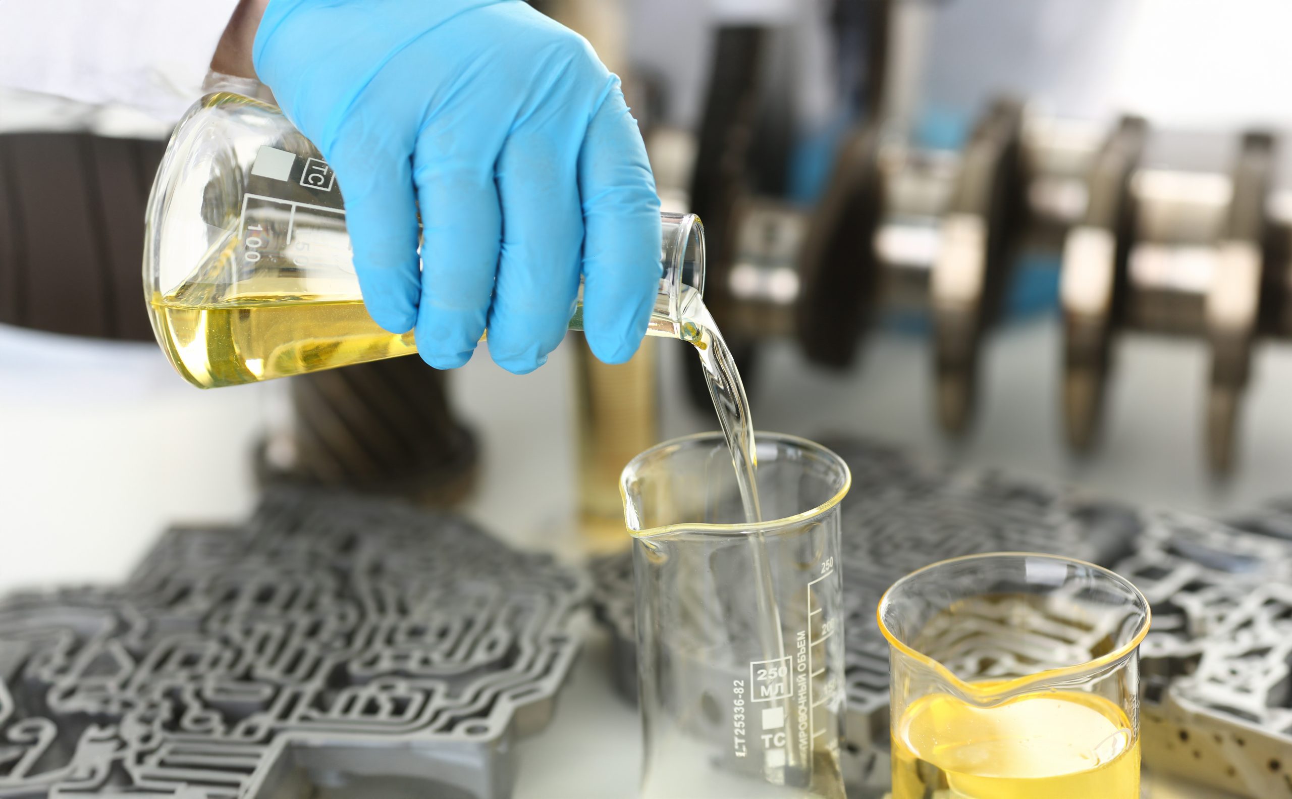 UAE Ester Lubricant Market Outlook to 2035 male-hands-protective-gloves-hold-test-tube-scaled