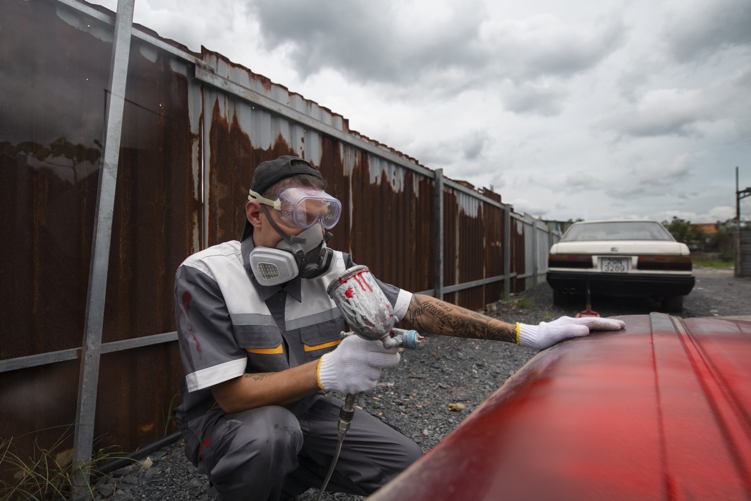 Italy Corrosion Inhibitor Market Advances as €550 Billion Manufacturing Sector Drives Protection Demand side-view-man-painting-car-door-1-scaled