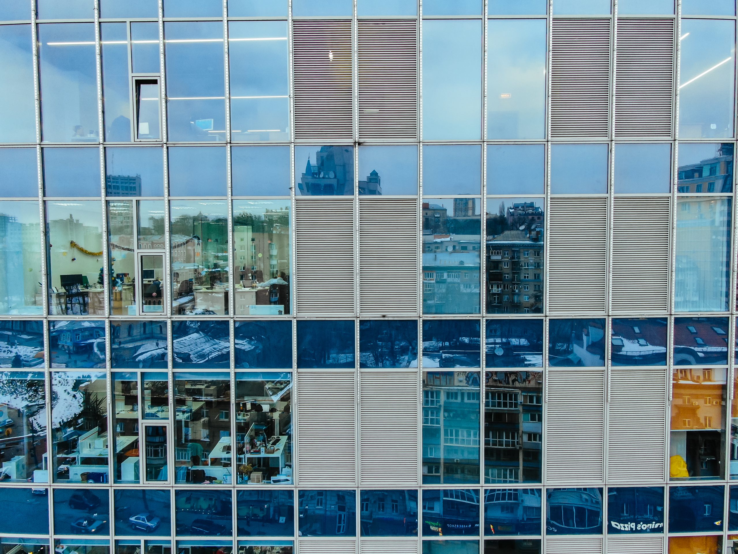 Vietnam Laminated Glass Market Expands with 8.5% CAGR Amid Rising Construction and Automotive Demand street-reflection-glass-steel-building-facade-scaled