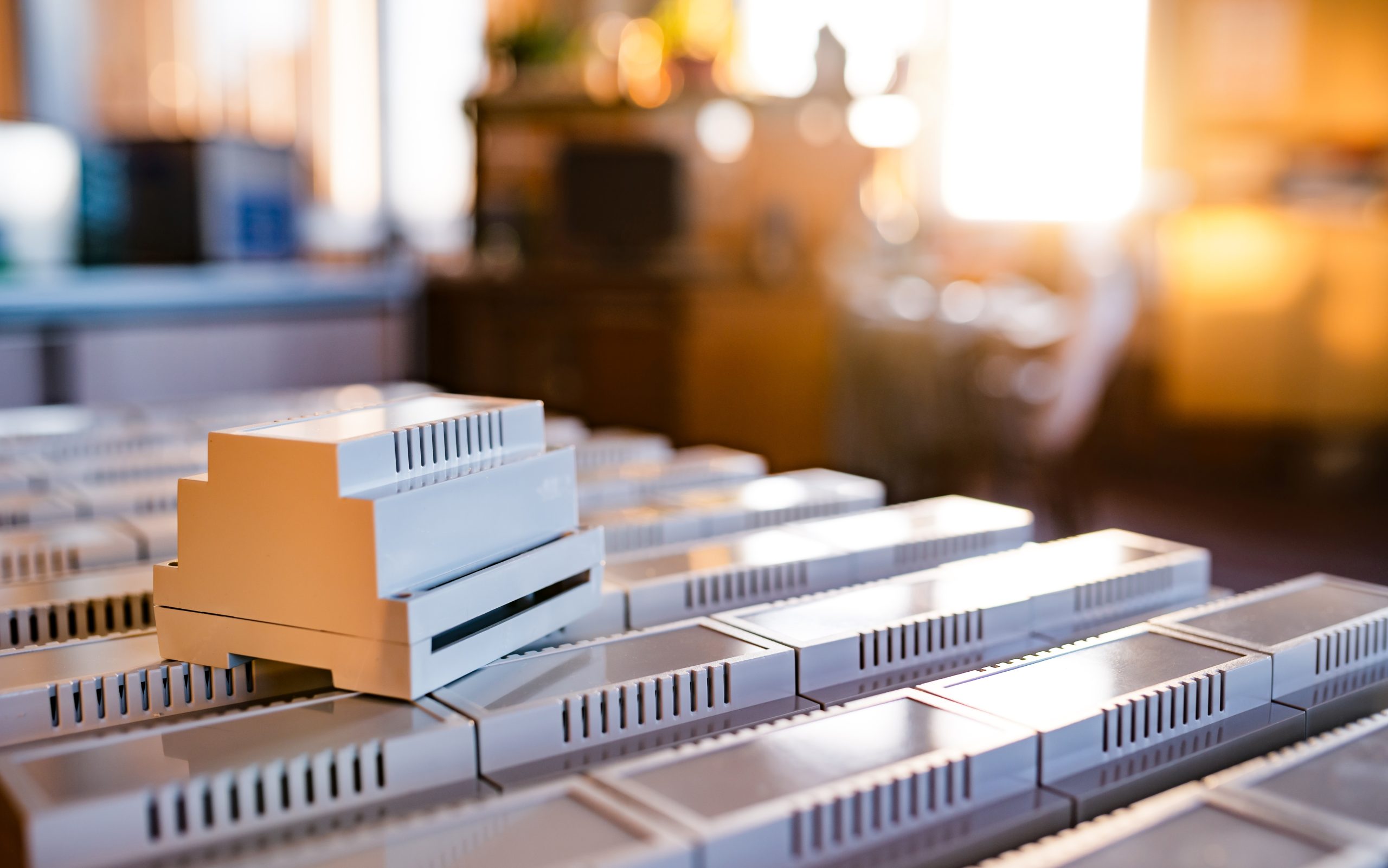 US Insulated Concrete Form Market Outlook to 2035 universal-plastic-cases-manufacture-serial-radio-electronic-products-is-golden-backlit-evening-light-from-window-plastic-case-mounting-din-rail-scaled