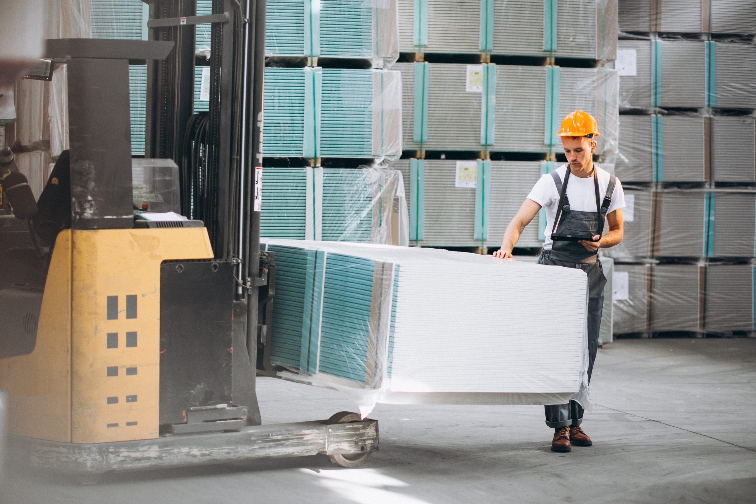 UK Insulated Concrete Form Market Expands Through 5.8% Growth and Rising Energy Efficient Building Demand young-man-working-warehouse-with-boxes-scaled
