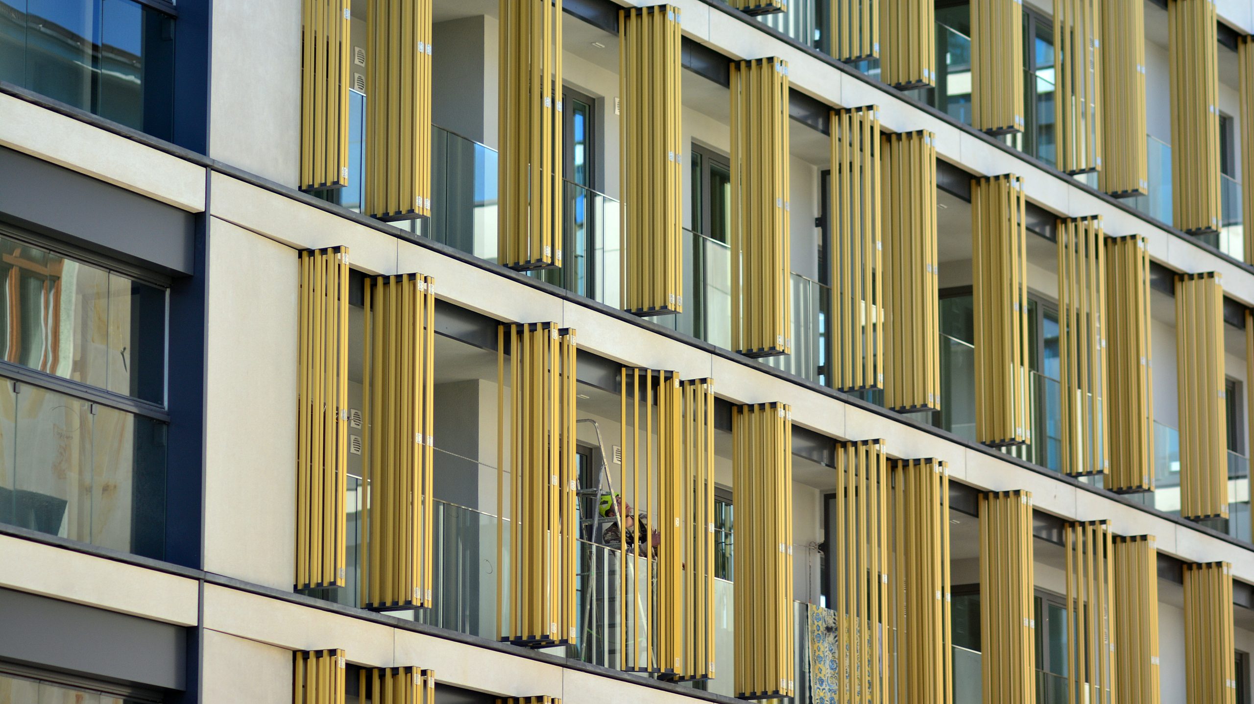 UAE Exterior Wall Systems Market Outlook to 2035 building-with-yellow-exterior-blue-green-design-scaled