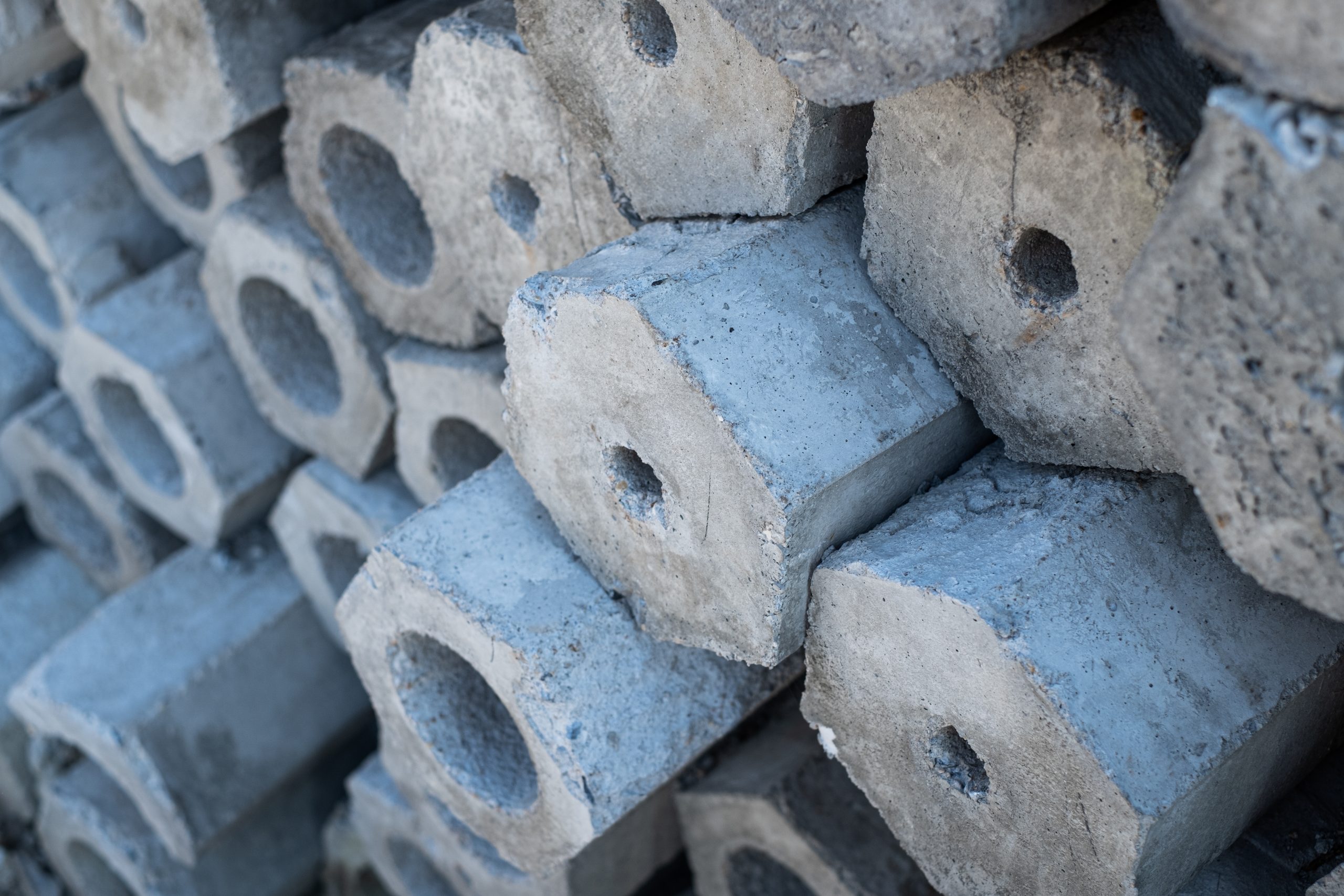 KSA Hollow Concrete Blocks Market Outlook to 2035 close-up-cross-sectional-area-stacked-concrete-pile-stake-scaled