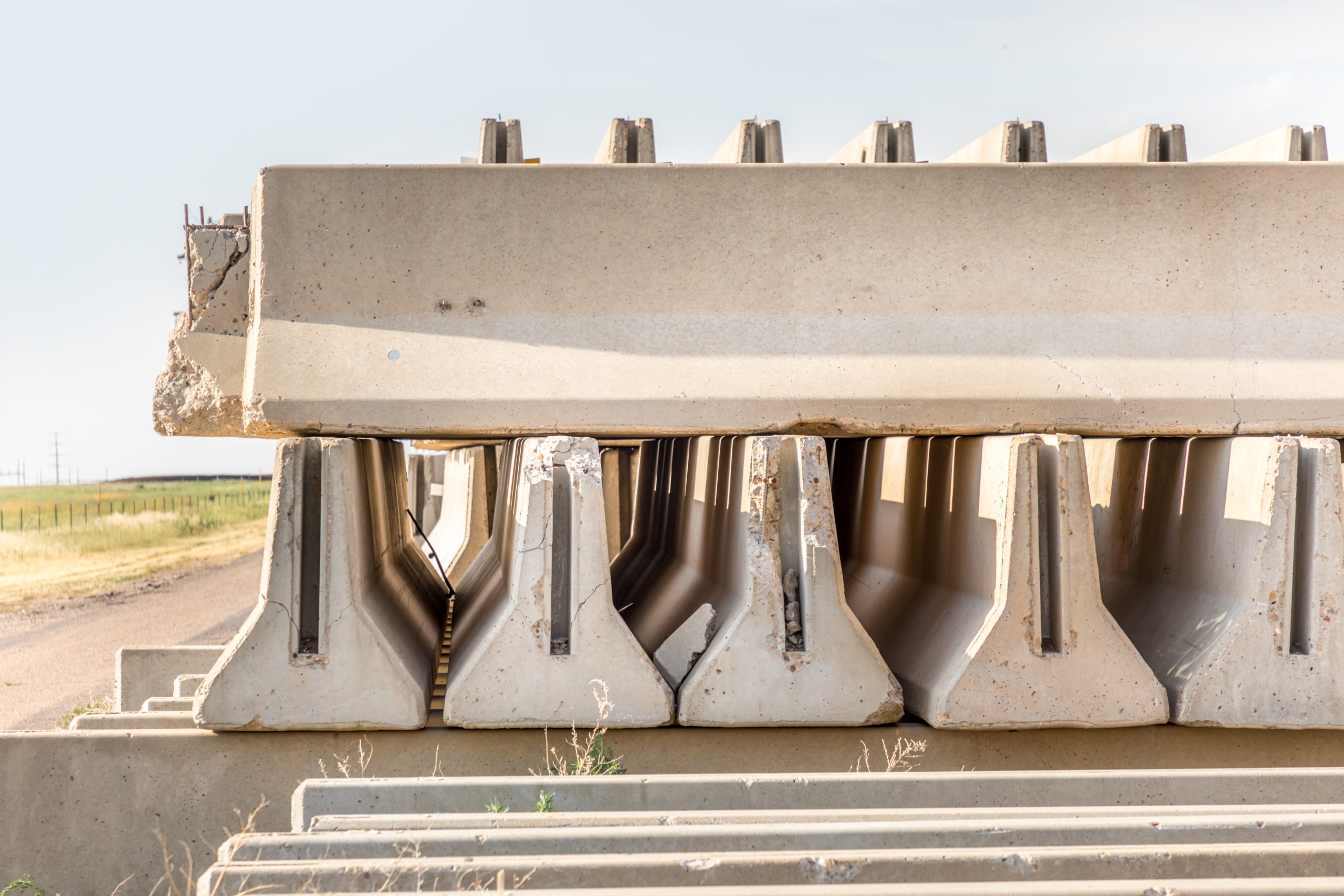 Singapore Precast Concrete Market Outlook to 2035 concrete-parts-piled-up-besides-rural-road-besides-highway-scaled