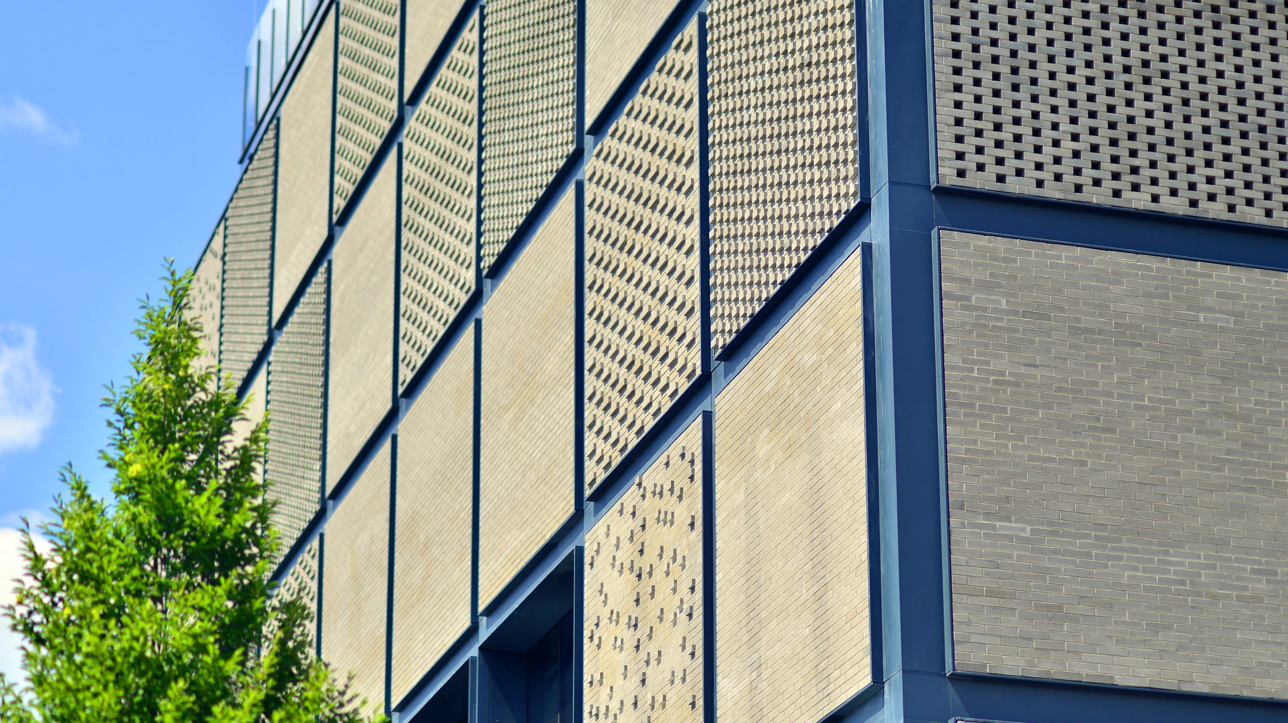 Singapore Rainscreen Cladding Market Outlook to 2035 exterior-modern-industrial-building-with-green-environment-corporate-building-reduce-co2-scaled