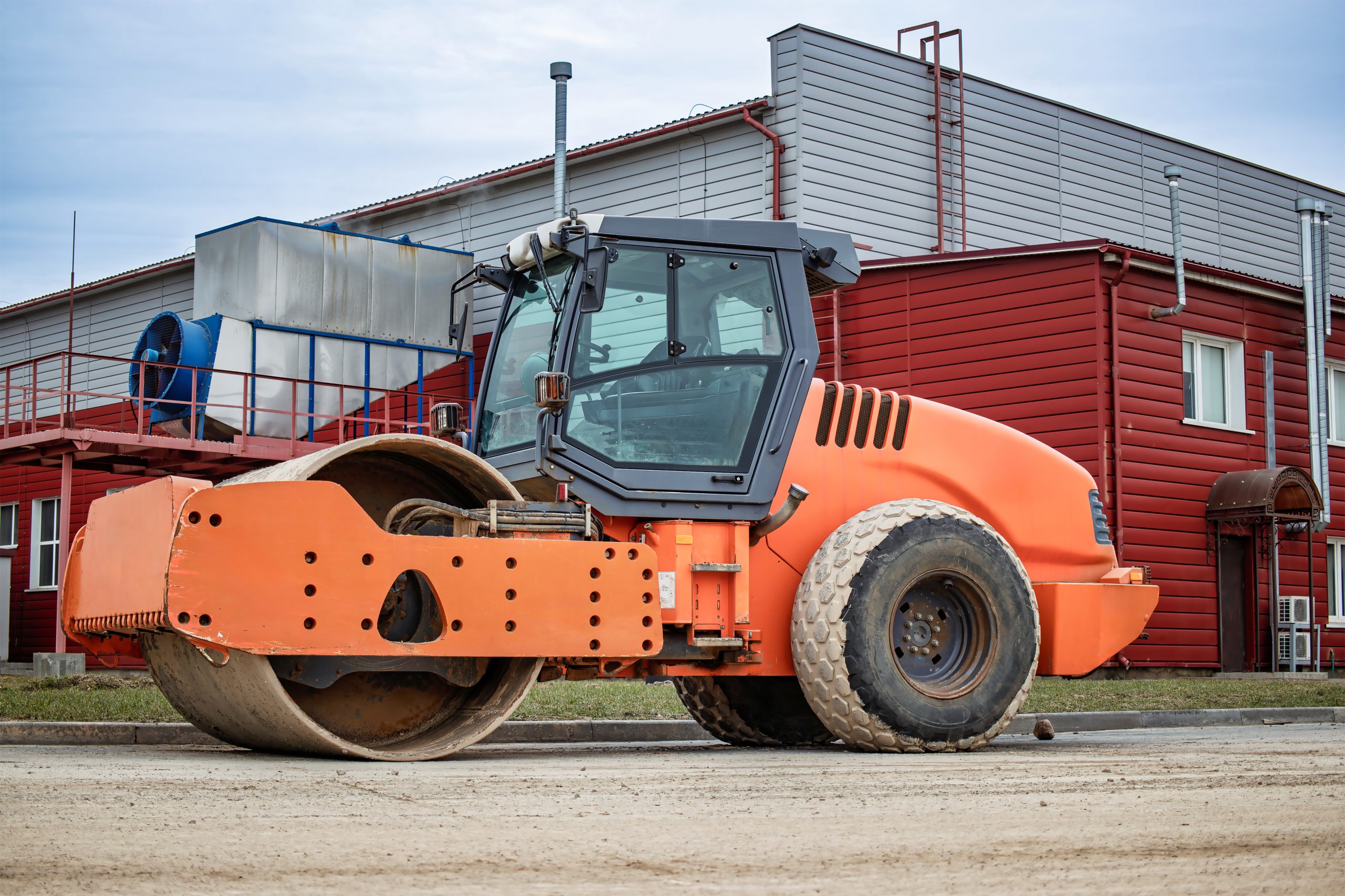 UAE Composite Rollers Market Outlook to 2035 heavy-roller-machinery-construction-site-near-industrial-buildings-cloudy-day-showcasing-construction-progress-urban-development-scaled