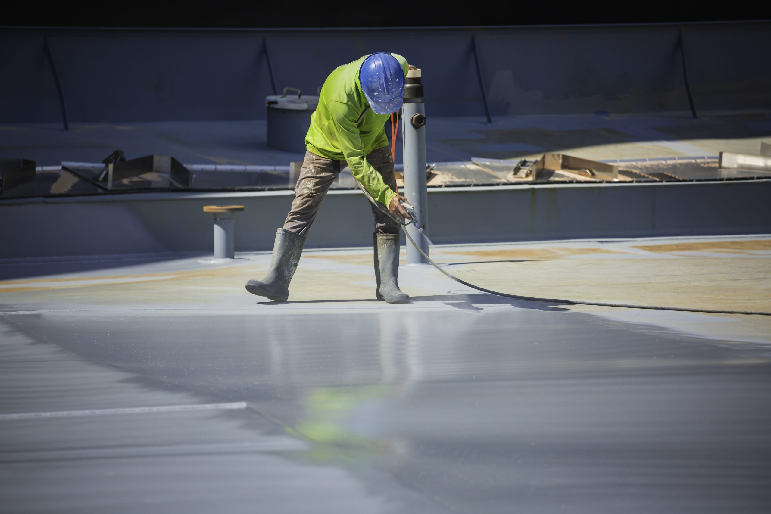 Italy Cool Roof Coatings and Systems Market Outlook to 2035 male-worker-holding-industrial-spray-gun-used-roof-plate-tank-surface-steel-industrial-painting-coating-scaled