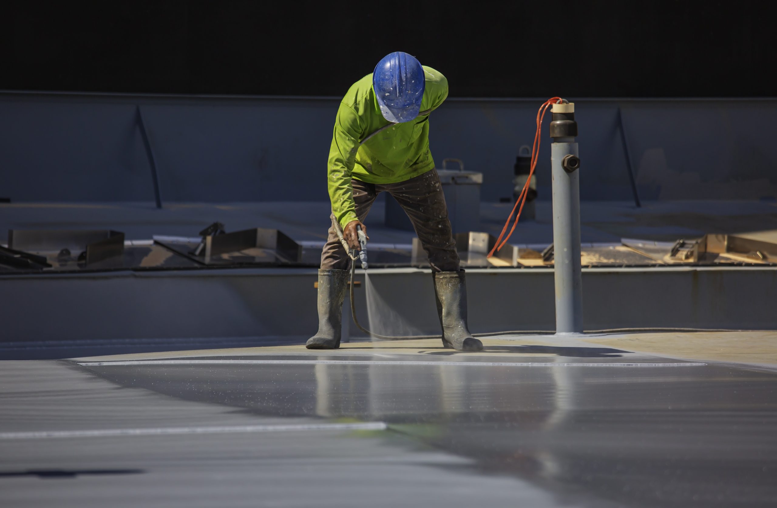 Mexico Cool Roof Coatings and Systems Market Outlook to 2035 male-worker-holding-industrial-spray-gun-used-roof-plate-tank-surface-steel-industrial-painting-scaled
