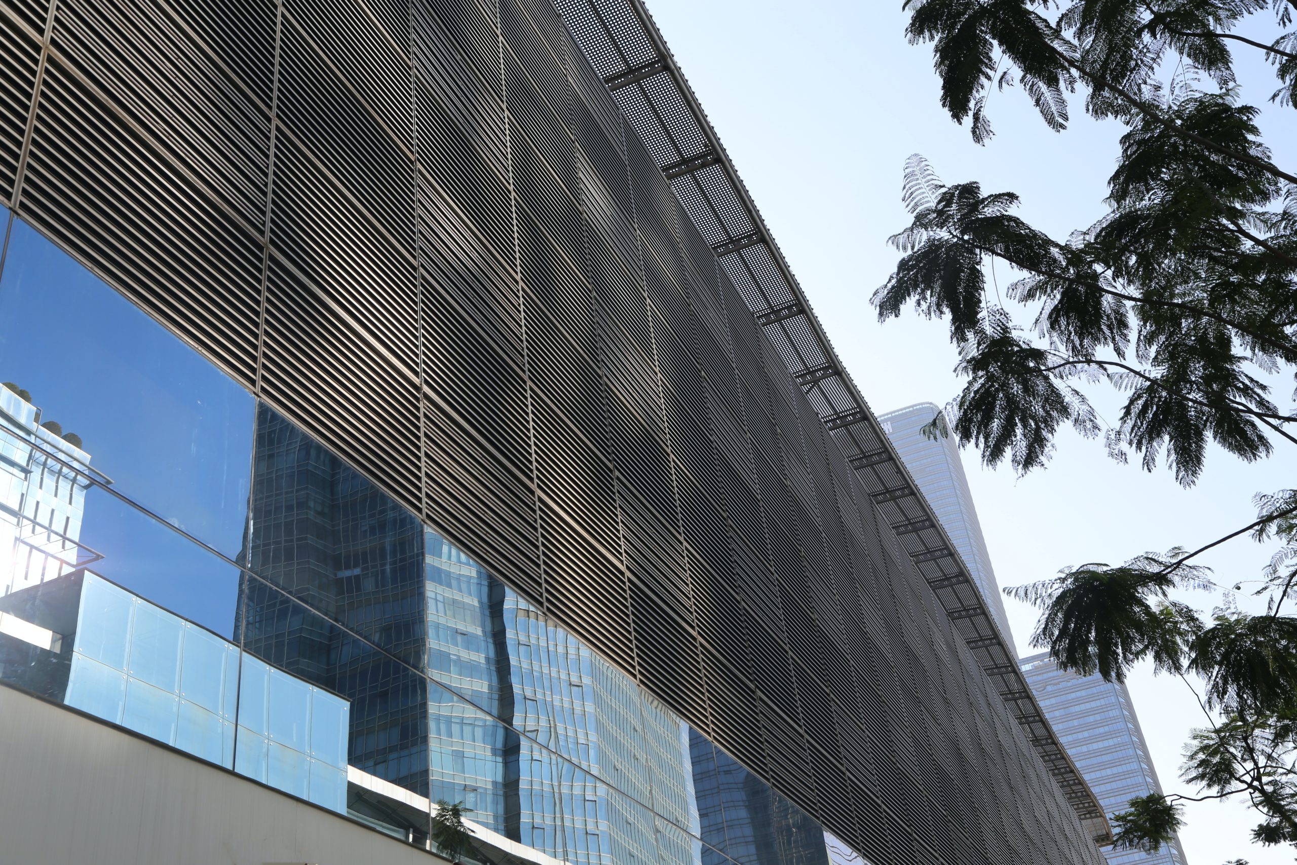 India Rainscreen Cladding Market Outlook to 2035 modern-building-facade-with-metal-mesh-sunshades-creating-urban-landscape-city-secluded-skyscrapers-scaled