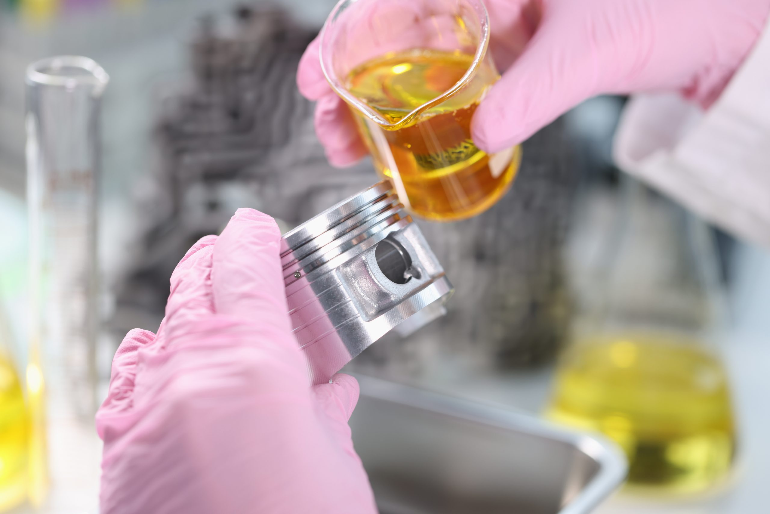 Germany Fluid Loss Additives Market Outlook to 2035 scientist-pours-engine-oil-piston-car-laboratory-closeup-scaled