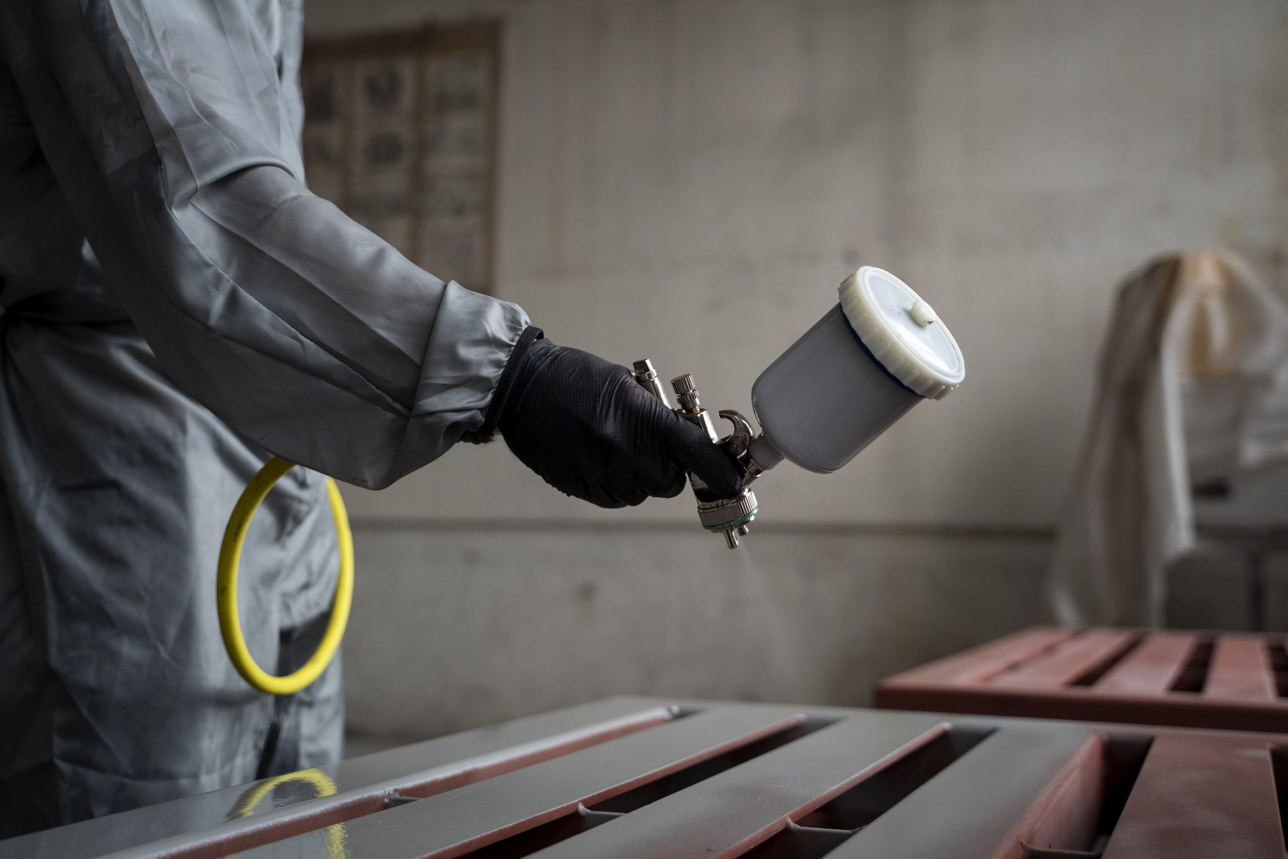 India Crosslinking Agents Market Advances as Manufacturing Contributes Nearly 17% of National GDP side-view-worker-spraying-powder-paint-from-gun-scaled