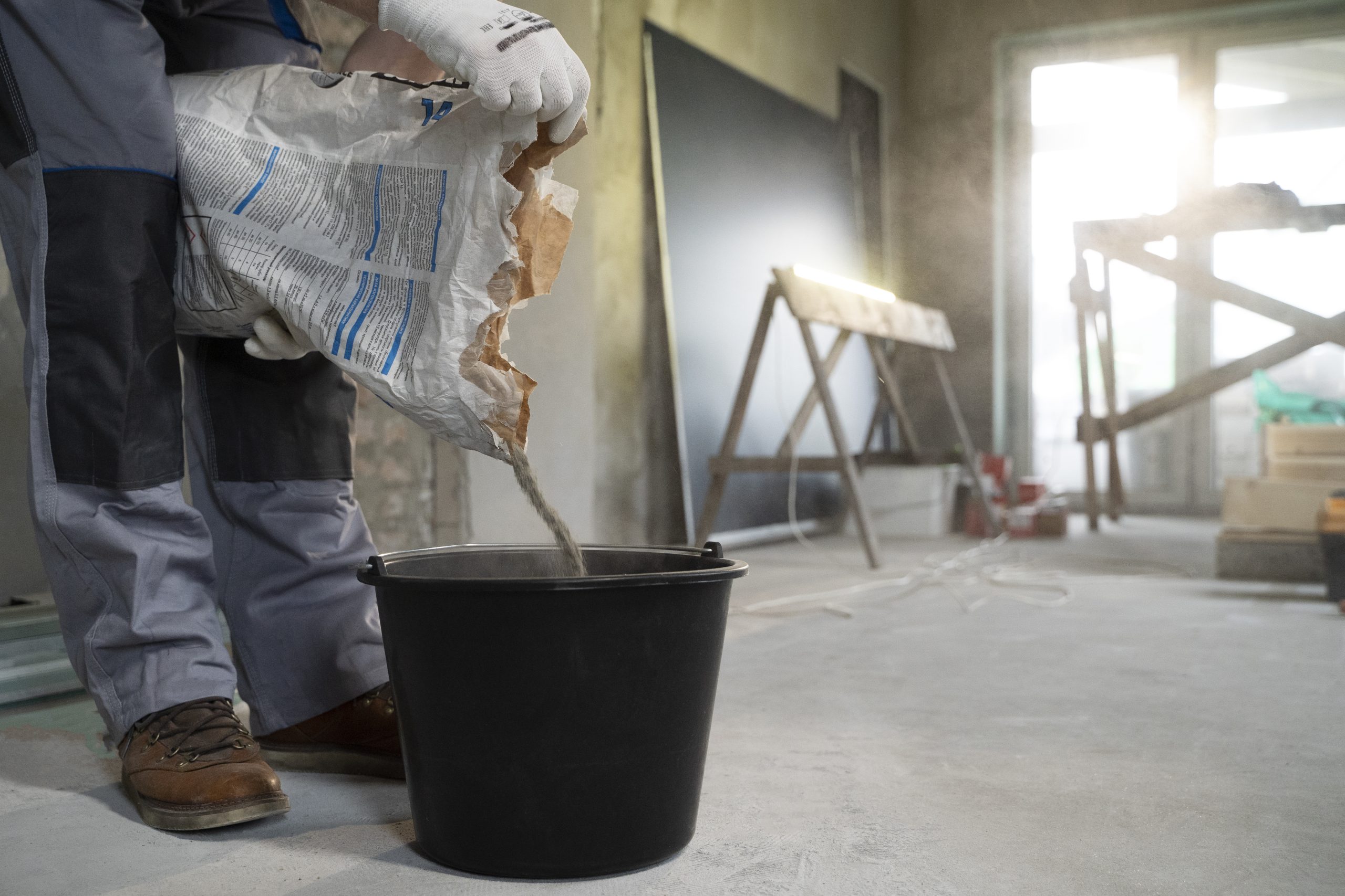 Philippines Construction Adhesives Market Outlook to 2035 tiler-working-renovation-apartment-scaled