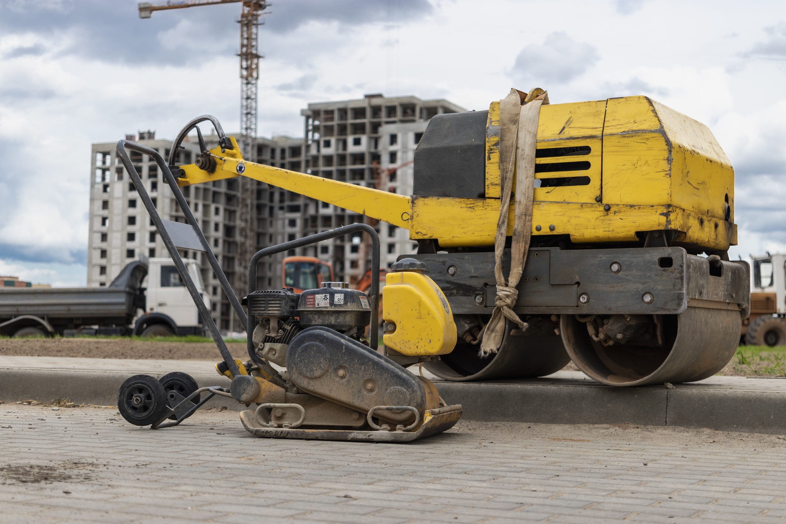 India Compact Construction Equipment Market Outlook to 2035 vibratory-rammer-with-vibrating-plate-construction-site-manual-roller-compaction-soil-before-laying-paving-slabs-closeup-scaled